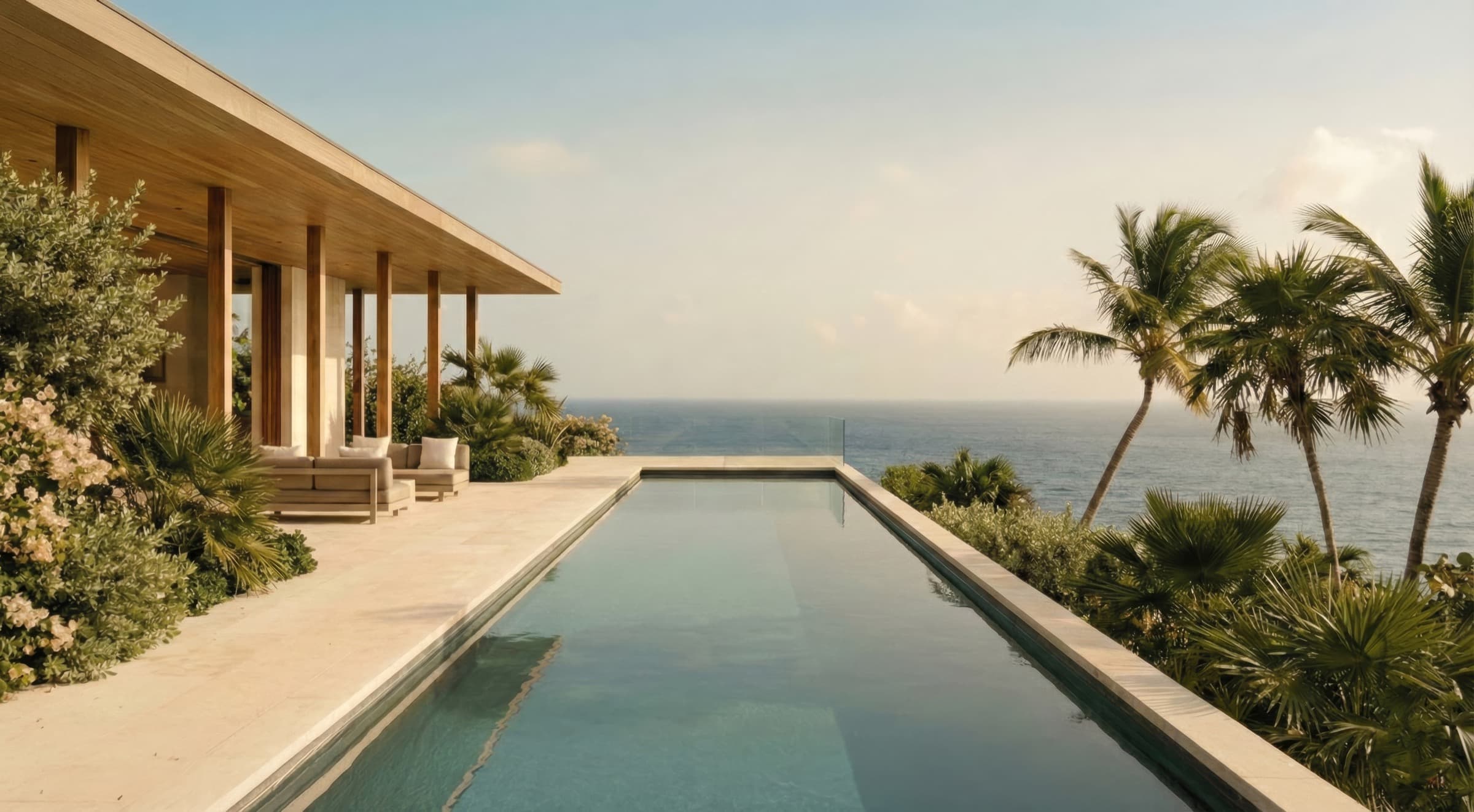 Private beach with umbrellas overlooking turquoise water
